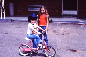 Morgan riding his bike in the hotel parking lot (wearing a cowboy hat like Dad)